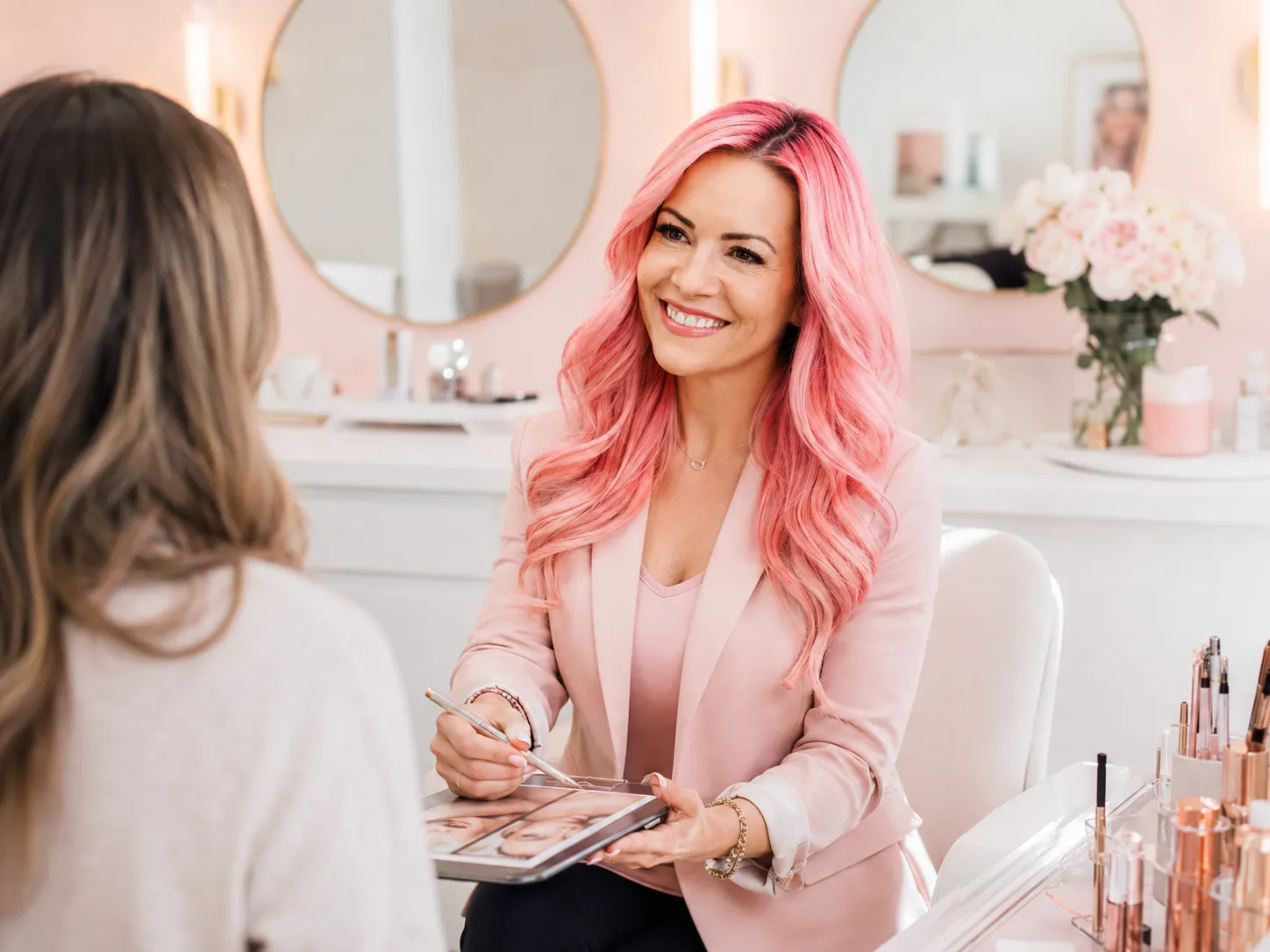 Cristianne Love consulting with a permanent makeup client